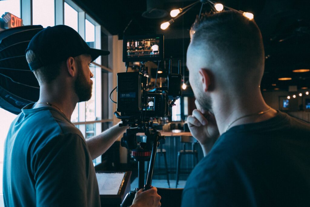 Two men working a camera on a film set